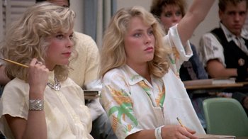Movie still from “Pretty in Pink” (1986), directed by Howard Deutch – A couple of women sitting next to each other in a room; Close Up shot, Low angle