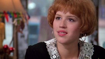 Movie still from “Pretty in Pink” (1986), directed by Howard Deutch – A person wearing a black and white shirt; Close Up shot, Over the shoulder angle