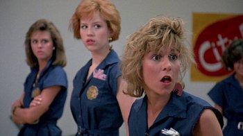 Movie still from “Pretty in Pink” (1986), directed by Howard Deutch – A group of women standing next to each other; Close Up shot, Low angle