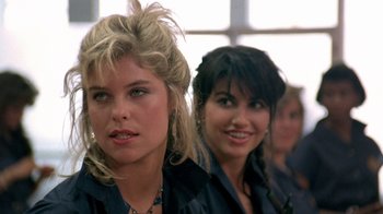 Movie still from “Pretty in Pink” (1986), directed by Howard Deutch – A couple of women standing next to each other in a room; Close Up shot, Over the shoulder angle
