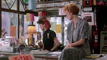 Movie still from “Pretty in Pink” (1986), directed by Howard Deutch – Two women sitting at a counter in a store; Medium shot, Over the shoulder angle