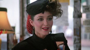 Movie still from “Pretty in Pink” (1986), directed by Howard Deutch – A person wearing a hat; Close Up shot, Over the shoulder angle