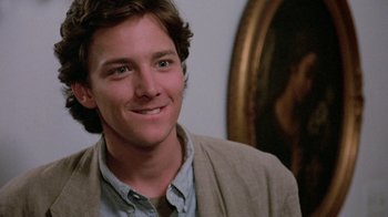 Movie still from “Pretty in Pink” (1986), directed by Howard Deutch – A person wearing a jacket; Close Up shot, Over the shoulder angle