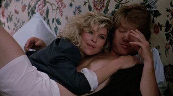 Movie still from “Pretty in Pink” (1986), directed by Howard Deutch – A man and a woman laying on a couch; Medium shot, Over the shoulder angle