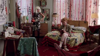 Movie still from “Pretty in Pink” (1986), directed by Howard Deutch – Two people in a room with a bed and a table; Wide shot, High angle