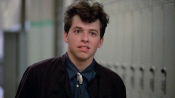 Movie still from “Pretty in Pink” (1986), directed by Howard Deutch – A young man with brown hair wearing a black jacket; Close Up shot, Low angle