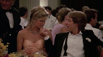 Movie still from “Pretty in Pink” (1986), directed by Howard Deutch – A man and a woman sitting at a dinner table; Medium shot, Over the shoulder angle