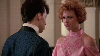 Movie still from “Pretty in Pink” (1986), directed by Howard Deutch – A man and a woman standing next to each other; Medium shot, Over the shoulder angle