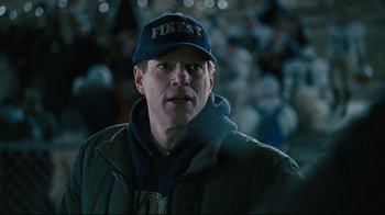 Movie still from “Pride and Glory” (2008), directed by Gavin O'Connor – A person wearing a hat; Close Up shot, High angle