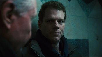 Movie still from “Pride and Glory” (2008), directed by Gavin O'Connor – A person looking at the camera; Close Up shot, Over the shoulder angle