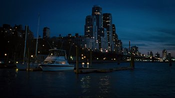 Movie still from “Pride and Glory” (2008), directed by Gavin O'Connor – A boat is in the water near a pier; Extreme Wide shot, High angle
