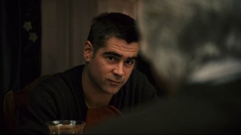 Movie still from “Pride and Glory” (2008), directed by Gavin O'Connor – A person sitting at a table; Close Up shot, Over the shoulder angle