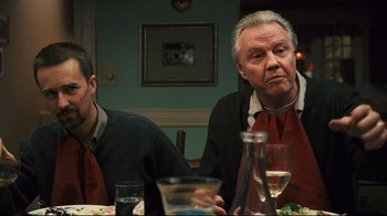 Movie still from “Pride and Glory” (2008), directed by Gavin O'Connor – Two men sitting at a dinner table with wine glasses; Medium shot, Over the shoulder angle