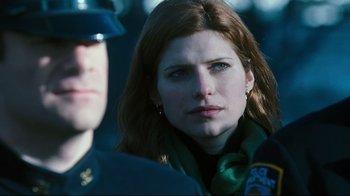 Movie still from “Pride and Glory” (2008), directed by Gavin O'Connor – A person wearing a military uniform; Close Up shot, Over the shoulder angle