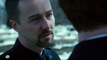 Movie still from “Pride and Glory” (2008), directed by Gavin O'Connor – A person with a beard; Close Up shot, Over the shoulder angle