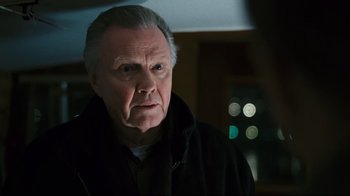 Movie still from “Pride and Glory” (2008), directed by Gavin O'Connor – An older man in a black jacket looking at the camera; Close Up shot, Over the shoulder angle