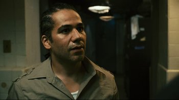 Movie still from “Pride and Glory” (2008), directed by Gavin O'Connor – A person wearing a brown shirt; Close Up shot, High angle