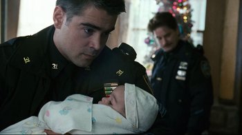 Movie still from “Pride and Glory” (2008), directed by Gavin O'Connor – A police officer holding a baby in his arms; Close Up shot, Over the shoulder angle