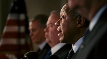 Movie still from “Pride and Glory” (2008), directed by Gavin O'Connor – A group of men in suits and ties talking to each other; Close Up shot, Low angle