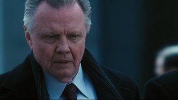 Movie still from “Pride and Glory” (2008), directed by Gavin O'Connor – An older man wearing a suit and tie; Close Up shot, Over the shoulder angle