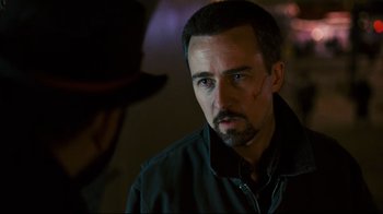 Movie still from “Pride and Glory” (2008), directed by Gavin O'Connor – A person wearing a black jacket; Close Up shot, Over the shoulder angle