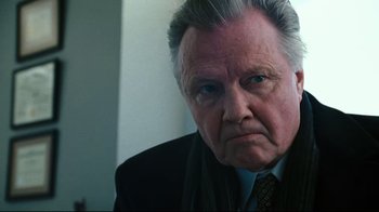 Movie still from “Pride and Glory” (2008), directed by Gavin O'Connor – An older man wearing a suit and tie looking at the camera; Close Up shot, Low angle