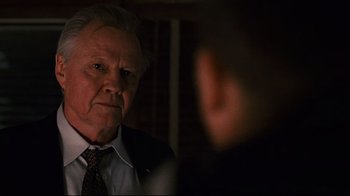 Movie still from “Pride and Glory” (2008), directed by Gavin O'Connor – An older man wearing a suit and tie looking into a mirror; Close Up shot, Over the shoulder angle