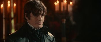 Movie still from “Pride and Prejudice and Zombies” (2016), directed by Burr Steers – A person wearing a jacket; Close Up shot, Over the shoulder angle