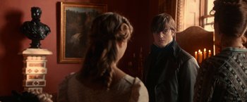 Movie still from “Pride and Prejudice and Zombies” (2016), directed by Burr Steers – A man and a woman looking at each other in front of a mirror; Medium shot, Over the shoulder angle