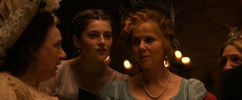 Movie still from “Pride and Prejudice and Zombies” (2016), directed by Burr Steers – Two women are standing next to each other; Close Up shot, Over the shoulder angle