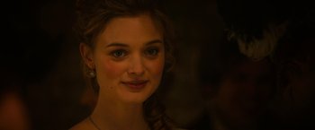 Movie still from “Pride and Prejudice and Zombies” (2016), directed by Burr Steers – A woman's face in the dark; Close Up shot, Over the shoulder angle
