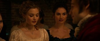 Movie still from “Pride and Prejudice and Zombies” (2016), directed by Burr Steers – Two beautiful young women standing next to each other; Close Up shot, Over the shoulder angle