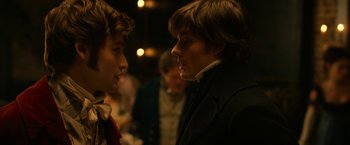 Movie still from “Pride and Prejudice and Zombies” (2016), directed by Burr Steers – Two young men are talking to each other; Close Up shot, Over the shoulder angle