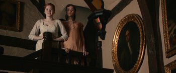 Movie still from “Pride and Prejudice and Zombies” (2016), directed by Burr Steers – Two young women standing on the stairs of a house; Medium shot, Low angle