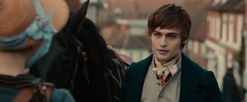 Movie still from “Pride and Prejudice and Zombies” (2016), directed by Burr Steers – A man in a suit and tie standing next to a horse; Close Up shot, Over the shoulder angle