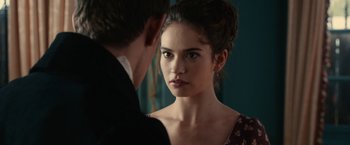 Movie still from “Pride and Prejudice and Zombies” (2016), directed by Burr Steers – A man and a woman looking at one another in a mirror; Close Up shot, Over the shoulder angle