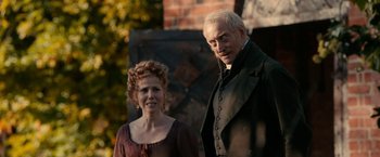 Movie still from “Pride and Prejudice and Zombies” (2016), directed by Burr Steers – A man and a woman standing next to each other; Medium shot, Over the shoulder angle