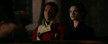 Movie still from “Pride and Prejudice and Zombies” (2016), directed by Burr Steers – A man and a woman are standing next to each other; Close Up shot, Over the shoulder angle