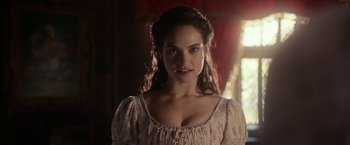 Movie still from “Pride and Prejudice and Zombies” (2016), directed by Burr Steers – A woman in a white dress with long hair; Close Up shot, Over the shoulder angle