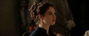 Movie still from “Pride and Prejudice and Zombies” (2016), directed by Burr Steers – A person wearing a black shirt; Close Up shot, Over the shoulder angle