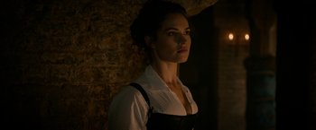 Movie still from “Pride and Prejudice and Zombies” (2016), directed by Burr Steers – A woman standing in front of a brick wall; Close Up shot, Low angle