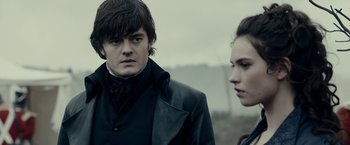 Movie still from “Pride and Prejudice and Zombies” (2016), directed by Burr Steers – A man and a woman standing next to each other; Close Up shot, Over the shoulder angle