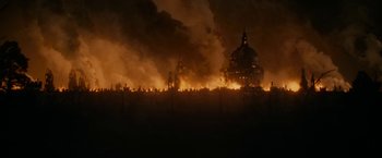 Movie still from “Pride and Prejudice and Zombies” (2016), directed by Burr Steers – A fire is burning in a field at night; Extreme Wide shot, High angle