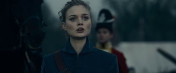 Movie still from “Pride and Prejudice and Zombies” (2016), directed by Burr Steers – A woman in a blue jacket is standing in front of a man in a uniform; Close Up shot, Over the shoulder angle