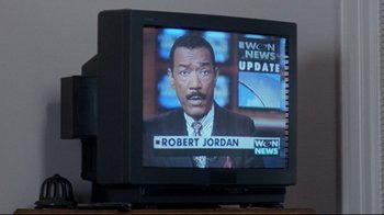 Movie still from “Primal Fear” (1996), directed by Gregory Hoblit – A television screen showing a news anchor on a news channel; Extreme Close Up shot, High angle