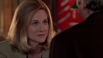 Movie still from “Primal Fear” (1996), directed by Gregory Hoblit – A person wearing a suit and tie; Close Up shot, Over the shoulder angle