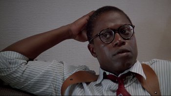 Movie still from “Primal Fear” (1996), directed by Gregory Hoblit – A man in a striped shirt and a red tie; Close Up shot, Low angle
