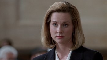 Movie still from “Primal Fear” (1996), directed by Gregory Hoblit – A person wearing a suit and tie; Close Up shot, Low angle