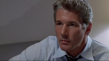 Movie still from “Primal Fear” (1996), directed by Gregory Hoblit – A person wearing a shirt and a tie; Close Up shot, Low angle