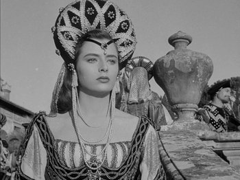 Movie still from “Prince of Foxes” (1949), directed by Henry King – A black and white photo of a woman in a costume; Medium shot, Low angle